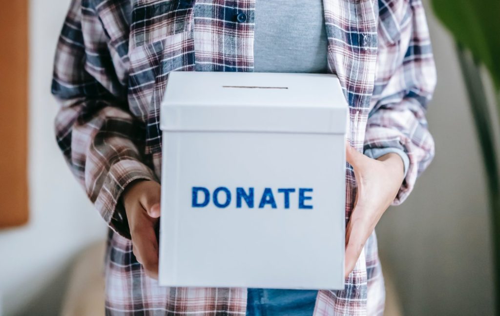 woman with donate box.